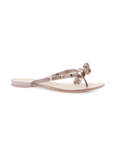 Shop Valentino Women's Rockstud Bow Metallic Jelly Thong Sandals In Neutral