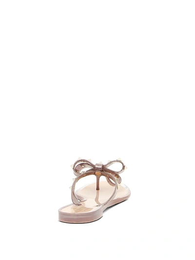 Shop Valentino Women's Rockstud Bow Metallic Jelly Thong Sandals In Neutral