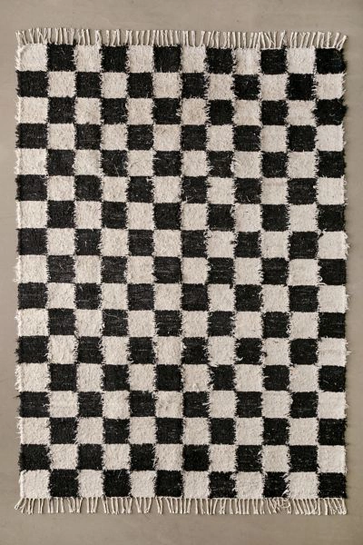 Shop Urban Outfitters Checkerboard Woven Shag Rag Rug In Black And Ivory At