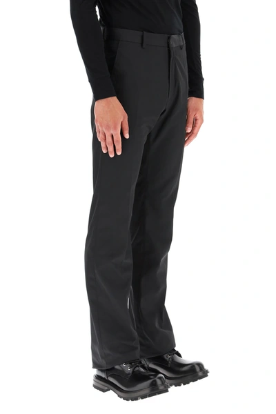 Shop Raf Simons Flared Trousers In Black