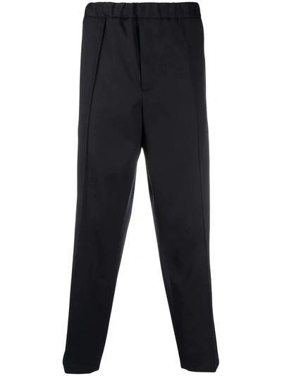 Shop Jil Sander Press-crease Relaxed Fit Trousers In Blau