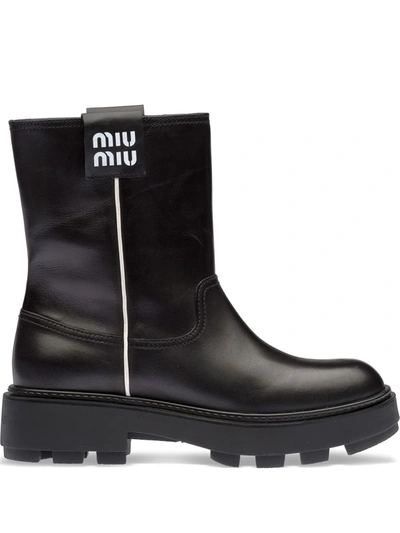 Shop Miu Miu Logo-patch Ankle Boots In Schwarz