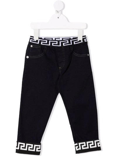 Shop Versace Greca-band Jeans In Blue