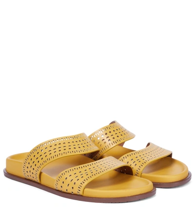 Shop Alaïa Laser-cut Leather Sandals In Yellow