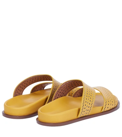 Shop Alaïa Laser-cut Leather Sandals In Yellow