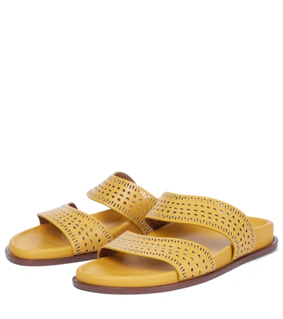 Shop Alaïa Laser-cut Leather Sandals In Yellow