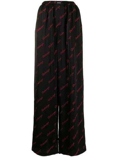 Shop Balenciaga Embroidered Logo Pattern Trousers In Schwarz