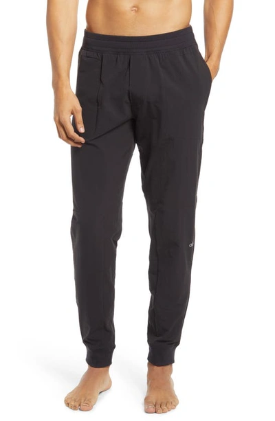 Shop Alo Yoga Co-op Pocket Tapered Joggers In Black