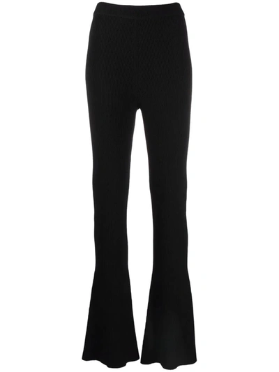 Shop Aeron Ribbed-knit Flared Trousers In Black