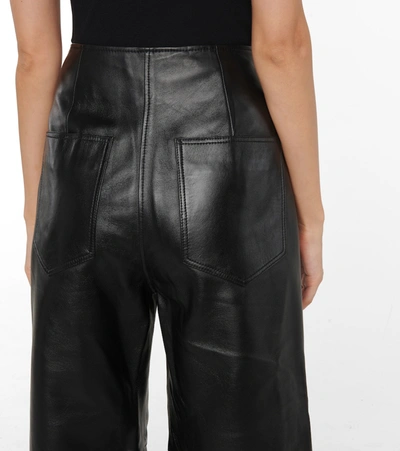 Shop Totême Leather Wide-leg Pants In Black