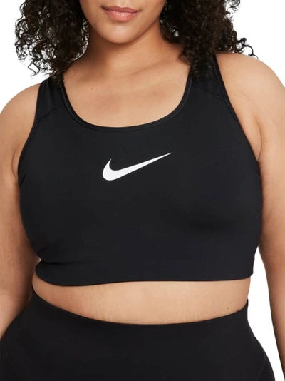 Shop Nike Plus Size Medium Impact Sports Bra In Black