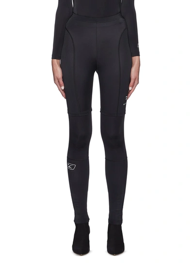 Shop Balenciaga Logo Print Panelled Leggings In Black