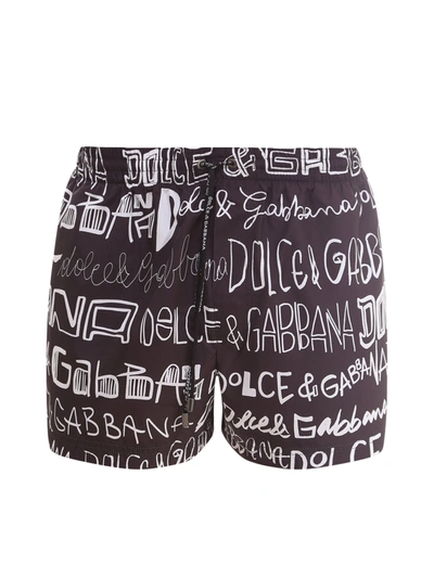 Shop Dolce & Gabbana Logo Printed Swim Trunks In Multi