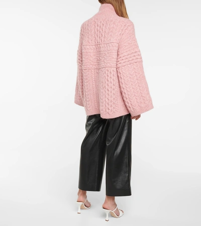 Shop Nanushka Raw Cable-knit Turtleneck Sweater In Pink