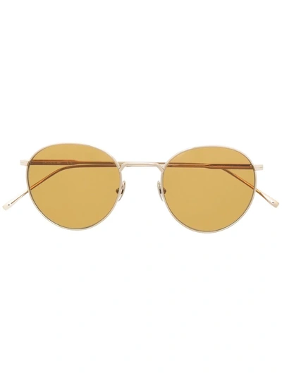 Shop Lacoste Round Metal-frame Sunglasses In Gold