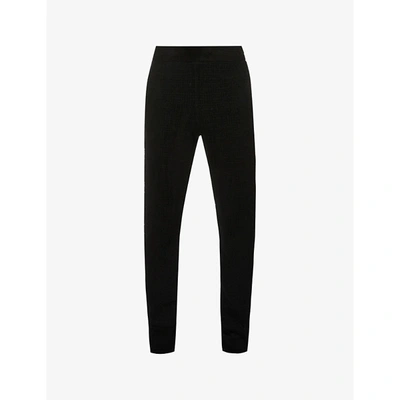 Shop Givenchy Mens Black Tapered Brand-pattern Cotton-blend Knitted Trousers M