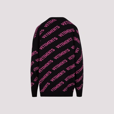 Shop Vetements Allover Logo Sweater In Black