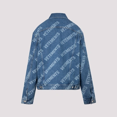 Shop Vetements All Over Logo Denim Jacket In Blue