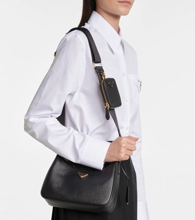 Prada Curved Black Bag With Gold Chain Strap And Logo Plaque In Black