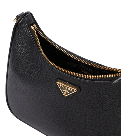 Prada Curved Black Bag With Gold Chain Strap And Logo Plaque In Black