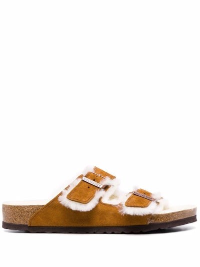 Shop Birkenstock Shearling-lined Sandals In 褐色