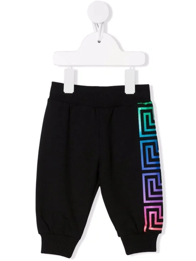 Shop Versace Greca-pattern Print Sweatpants In 黑色