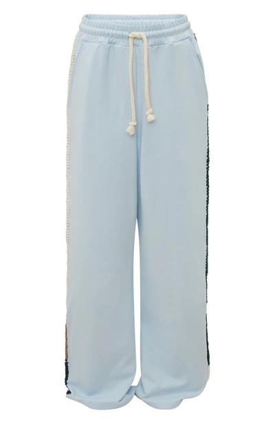 Shop Jw Anderson Contrast Stitch Wide Leg Track Pants In Baby Blue