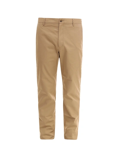 Shop Burberry Tapered Chino Trousers In Beige
