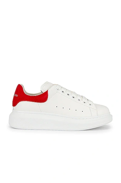 Shop Alexander Mcqueen Lace Up Sneakers In White & Lust Red