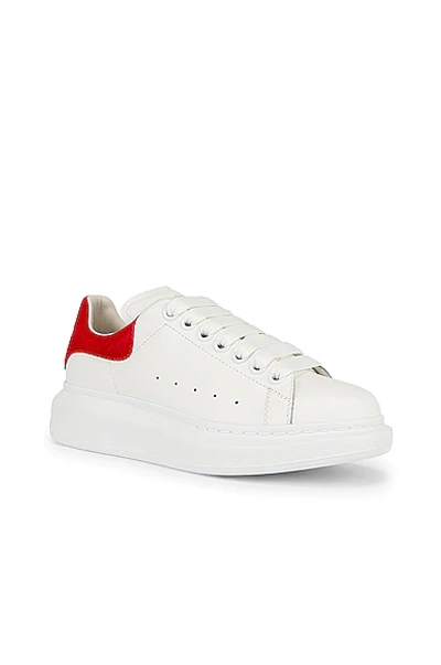 Shop Alexander Mcqueen Lace Up Sneakers In White & Lust Red