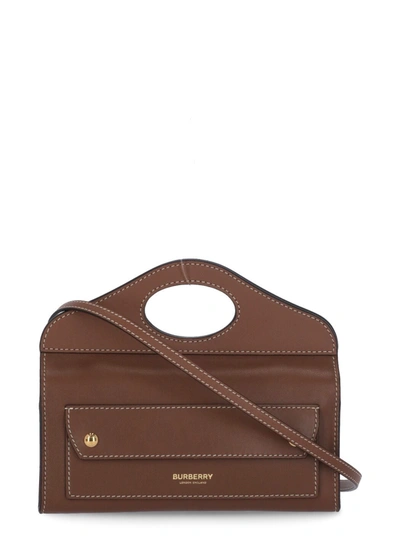 Shop Burberry Topstitched Pocket Mini Clutch Bag In Brown