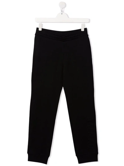 Shop Balmain Embossed-logo Track Pants In Black