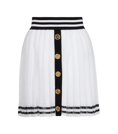 Shop Balmain Pleated Monogram Knit Miniskirt In White