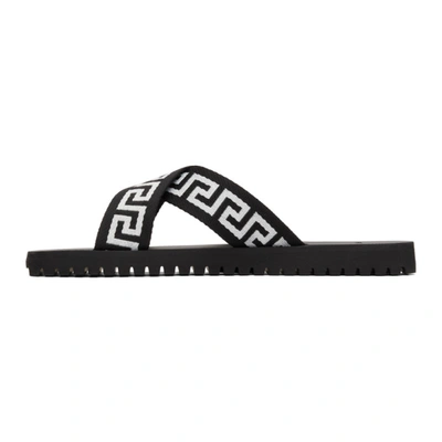 Shop Versace Black & White Nastro Greca Cross Strap Sandals In Black/white