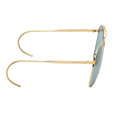 Shop Gucci Gold Gg0953 Sunglasses In Gold/light Blue