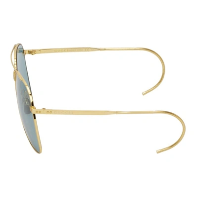 Shop Gucci Gold Gg0953 Sunglasses In Gold/light Blue