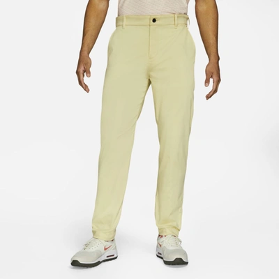 Shop Nike Dri-fit Uv Men's Standard Fit Golf Chino Pants In Lemon Drop