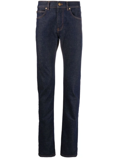 Shop Versace Contrast-stitch Slim-cut Jeans In Blau