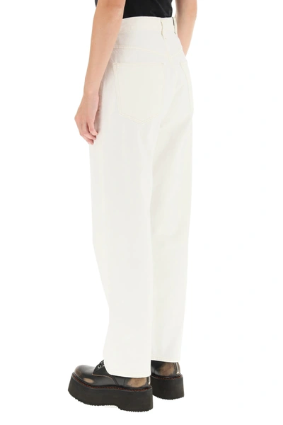 Shop Agolde Criss Cross Jeans In White