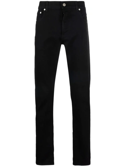 Shop Alexander Mcqueen Logo-print Slim-cut Jeans In 黑色