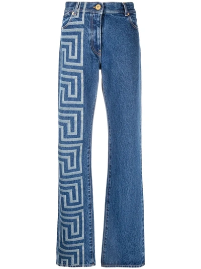 Shop Versace Greca-print Bootcut Jeans In 蓝色