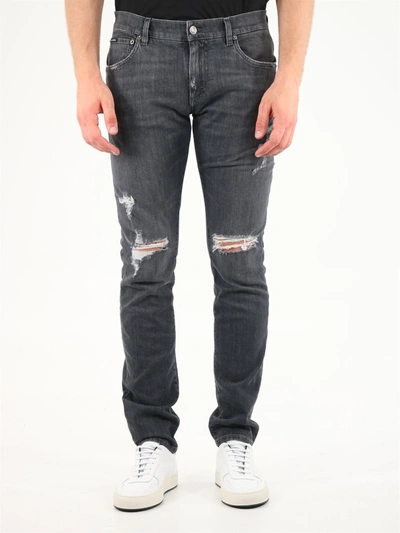 Shop Dolce & Gabbana Ripped Skinny Leg Jeans In Black