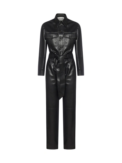 Shop Nanushka Belted Faux Leather Jumpsuit In Black