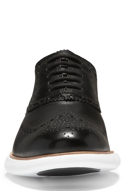 Shop Cole Haan 2.zerogrand Wingtip Oxford In Black Leather/ Optic White