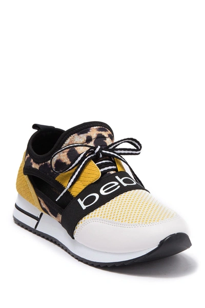 Shop Bebe Brienna Open Side Sneaker In White/yellow