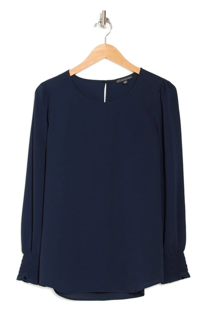 Shop Adrianna Papell Solid Long Sleeve Smocked Cuff Blouse In Solid Blue Moon