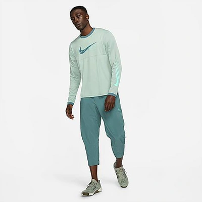 Shop Nike Men's Sport Clash Jogger Pants In Hasta/green Glow