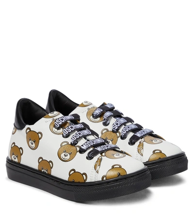 Shop Moschino Printed Leather Sneakers In White