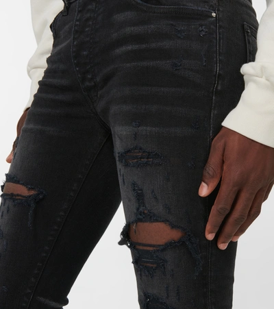 Shop Amiri Trasher Plus Jeans In Black