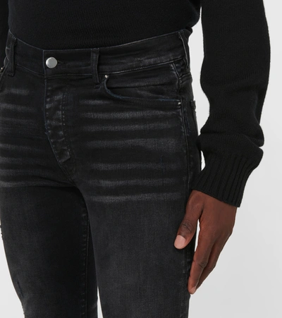 Shop Amiri Slash Jeans In Black